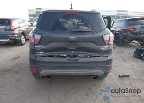 2017 Ford Escape Titanium z USA, uszkodzony, nr VIN 1FMCU0J93HUC49195